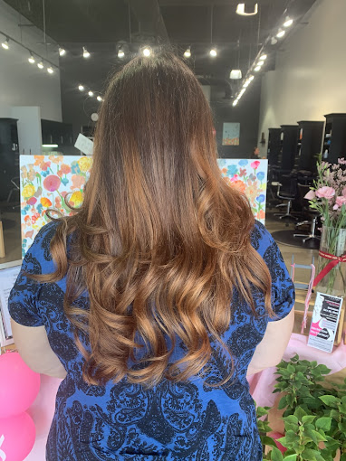 The back of a woman's head in a salon