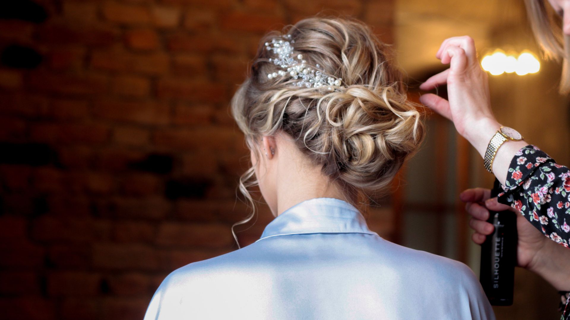 A woman getting her hair done by another woman